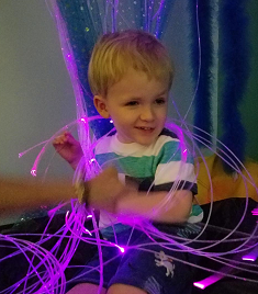 child plays with lights