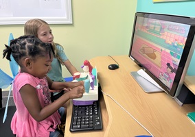 children play on computer