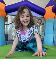 girl coloring at pumpkin patch