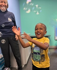 boy plays with bubbles