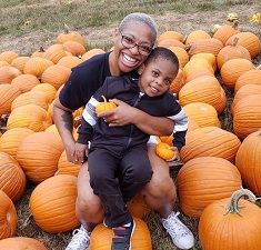 mom and child at pumpkin patch