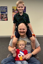 dad plays with kids