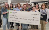 lekotek leaders accept check from sponsor
