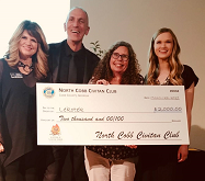 Lekotek Leader accepts check from Cobb Civitan