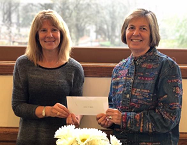 Lekotek Director accepts check